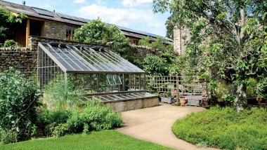 Bespoke Hartley Botanic Lean-To Greenhouse in a Garden